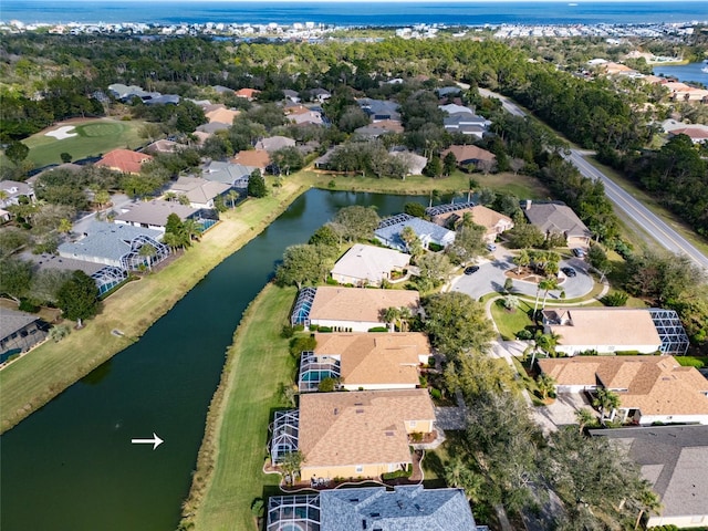 birds eye view of property featuring a residential view and a water view