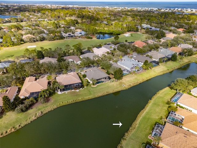 drone / aerial view with a water view and a residential view