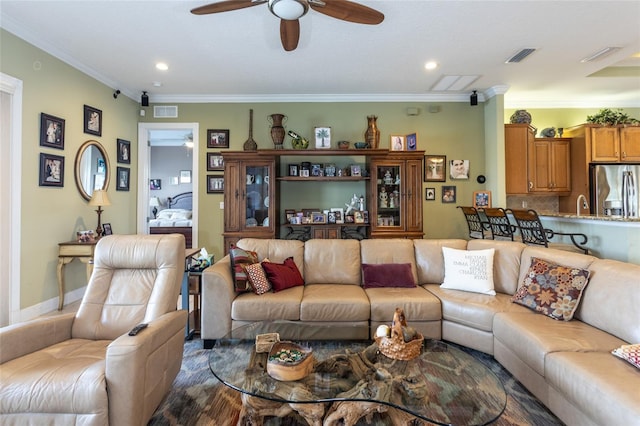 living room featuring visible vents, ornamental molding, a ceiling fan, and recessed lighting