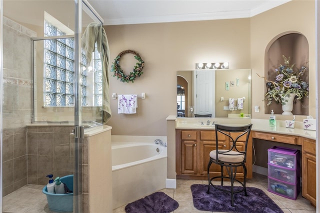 full bathroom featuring a stall shower, a garden tub, crown molding, and vanity