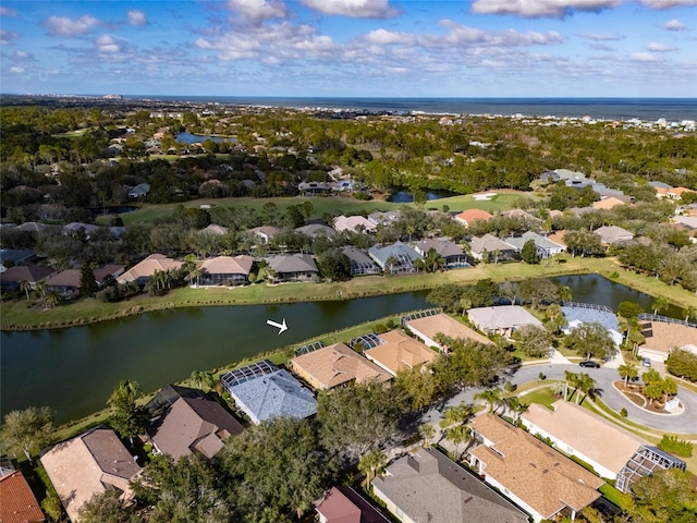 birds eye view of property with a water view and a residential view