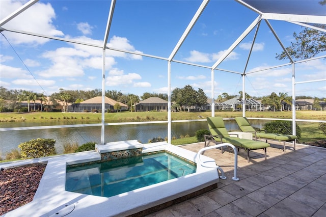 view of pool featuring a patio area, a water view, a lanai, and a jacuzzi