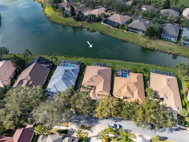 birds eye view of property featuring a water view and a residential view