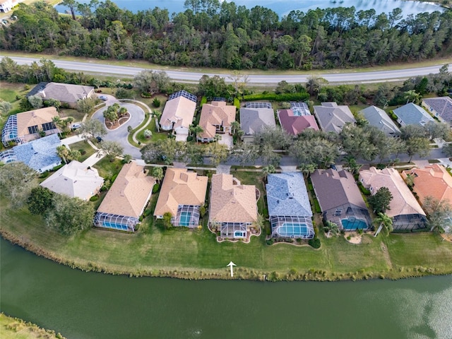 birds eye view of property featuring a water view and a residential view