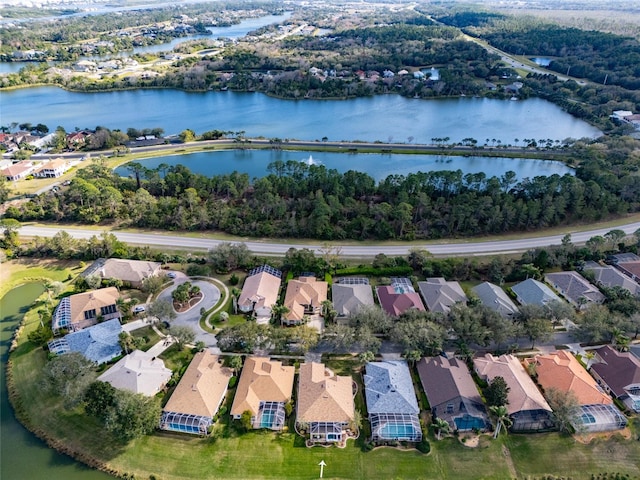 drone / aerial view with a water view and a residential view