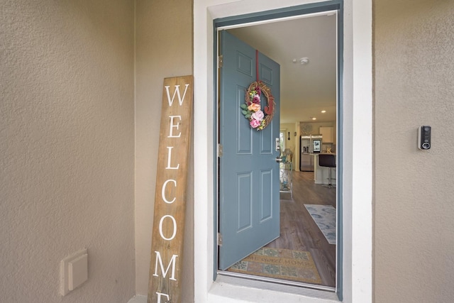 entrance to property with stucco siding