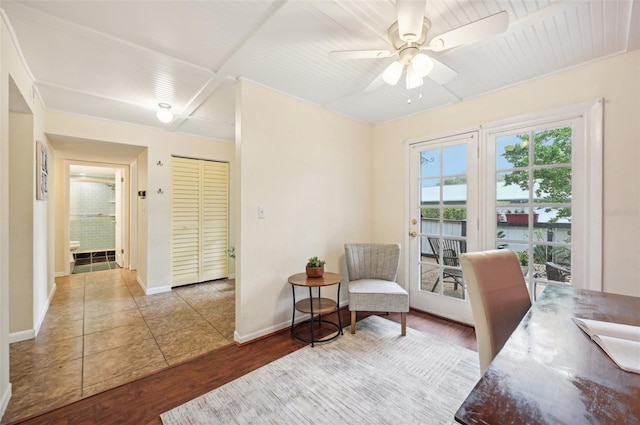 tiled office space featuring ceiling fan