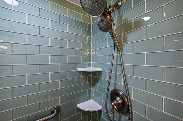 bathroom with a tile shower