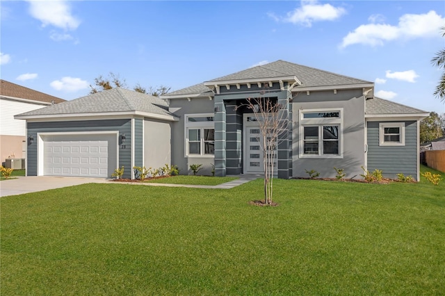 prairie-style house featuring central AC, a front lawn, and a garage