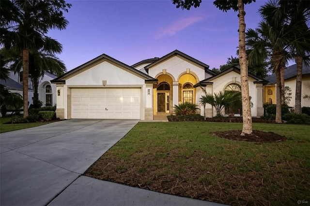 71 Southlake Dr, Palm Coast, FL 32137 - view of front of property featuring a garage, stucco siding, a yard, and driveway