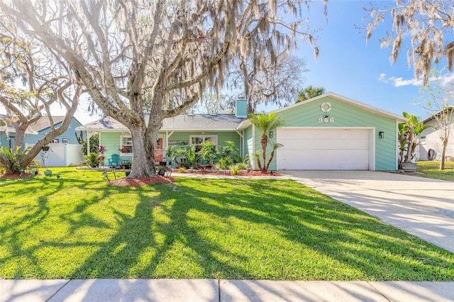 single story home featuring fence, a chimney, driveway, a garage, and a front yard