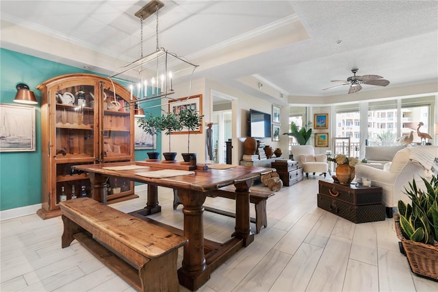 200 Ocean Crest Dr Unit 306, Palm Coast, FL 32137 - dining space featuring ornamental molding, a tray ceiling, and ceiling fan with notable chandelier