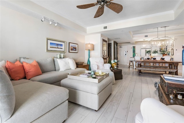 200 Ocean Crest Dr Unit 306, Palm Coast, FL 32137 - living area featuring ceiling fan with notable chandelier, visible vents, ornamental molding, light wood-type flooring, and a raised ceiling