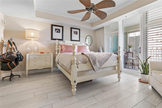 200 Ocean Crest Dr Unit 306, Palm Coast, FL 32137 - bedroom with a tray ceiling, crown molding, light wood-style flooring, and baseboards