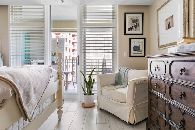 200 Ocean Crest Dr Unit 306, Palm Coast, FL 32137 - bedroom with access to outside and multiple windows