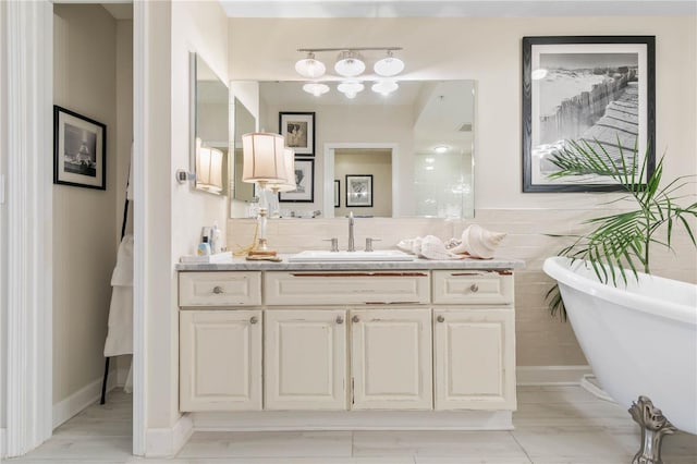 200 Ocean Crest Dr Unit 306, Palm Coast, FL 32137 - bathroom featuring a freestanding bath and vanity