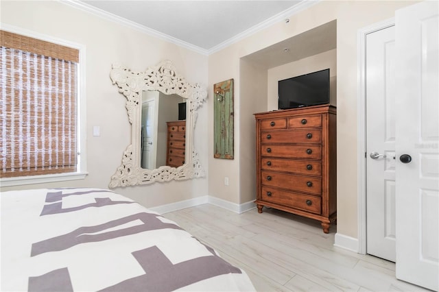 200 Ocean Crest Dr Unit 306, Palm Coast, FL 32137 - bedroom with light wood-style floors, baseboards, and crown molding