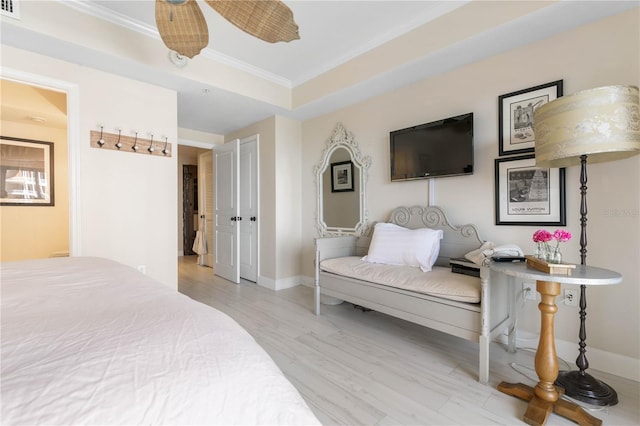 200 Ocean Crest Dr Unit 306, Palm Coast, FL 32137 - bedroom with light wood-style floors, baseboards, a raised ceiling, and crown molding