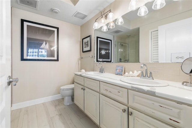 200 Ocean Crest Dr Unit 306, Palm Coast, FL 32137 - full bathroom with a stall shower, visible vents, a sink, and double vanity