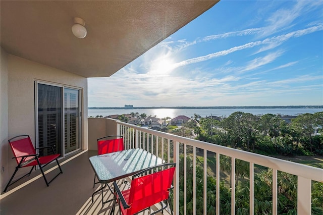 balcony featuring a water view