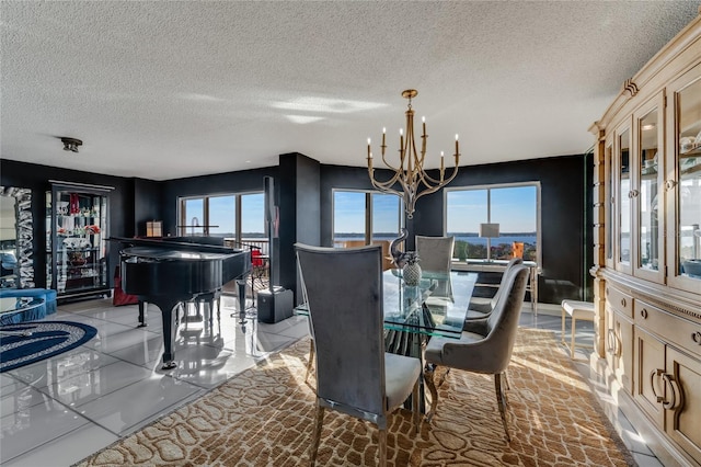 dining area featuring a chandelier and baseboards