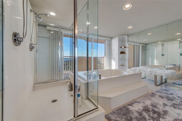 full bath with recessed lighting, a shower stall, and a bath