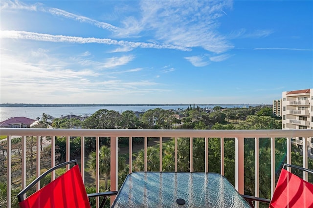 balcony featuring a water view