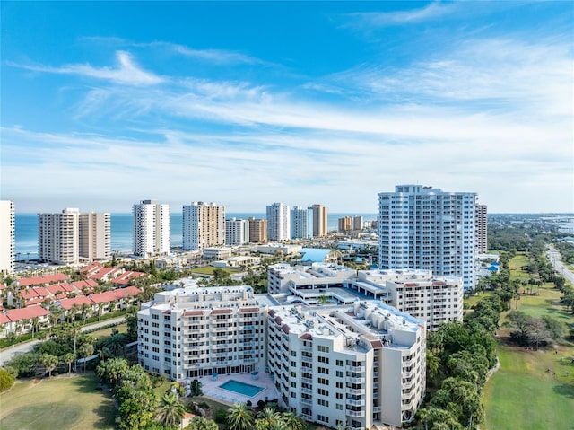 birds eye view of property featuring a water view and a city view