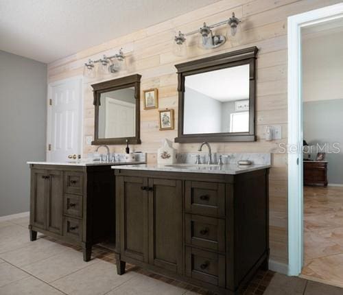 full bath featuring vanity, ensuite bath, and tile patterned floors