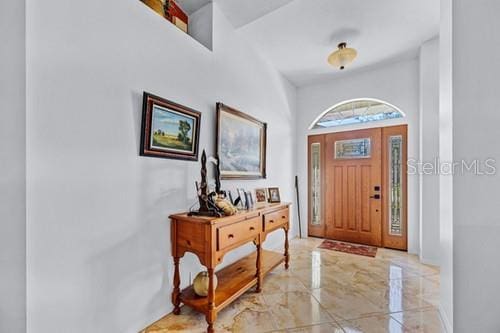 entryway with marble finish floor