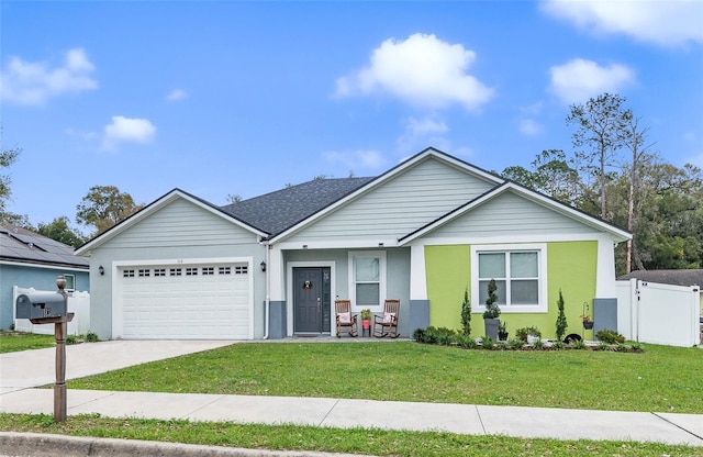 single story home with a garage, a front lawn, concrete driveway, and roof with shingles