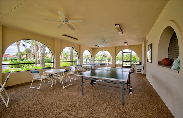 rec room featuring ceiling fan and carpet