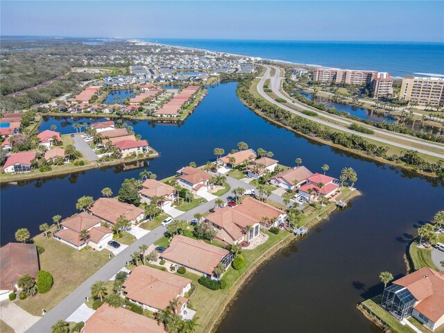 aerial view with a water view and a residential view