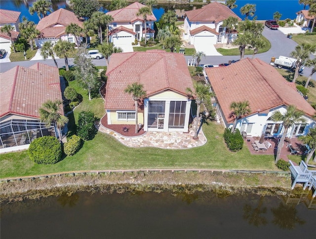 aerial view featuring a residential view and a water view