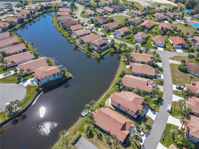 aerial view featuring a residential view and a water view