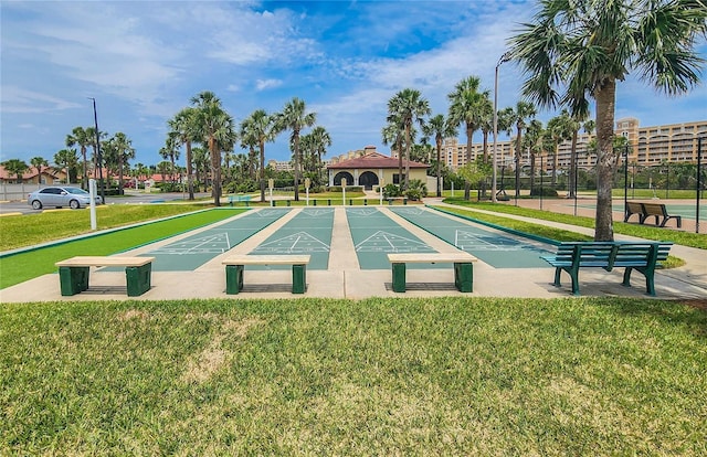 8 San Miguel Ct, Palm Coast, FL 32137 - surrounding community with a lawn and shuffleboard