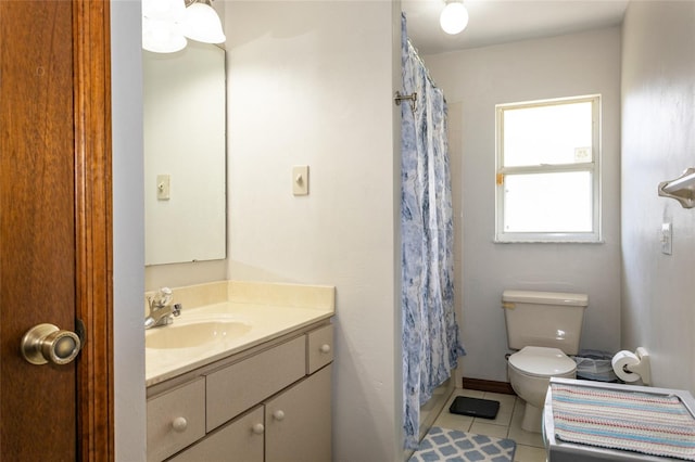 full bathroom with a shower with curtain, vanity, toilet, and tile patterned floors