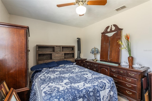 bedroom with a ceiling fan and visible vents