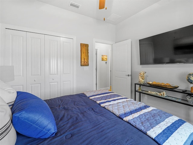 bedroom with a ceiling fan, visible vents, and a closet