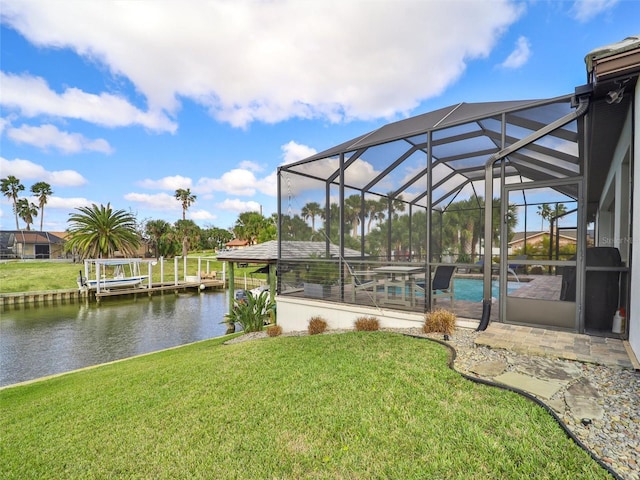 view of property's community featuring a water view and a yard