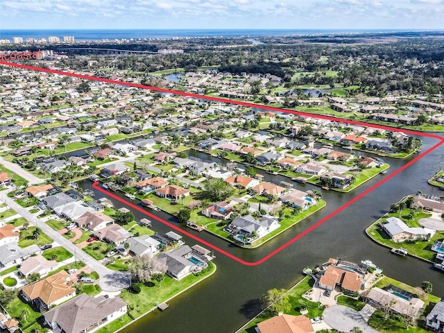 bird's eye view with a water view and a residential view