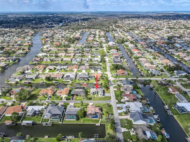 aerial view with a residential view and a water view