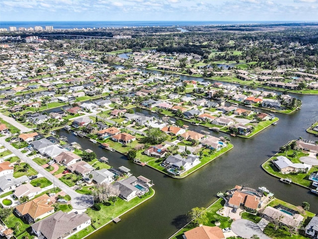 drone / aerial view featuring a water view and a residential view