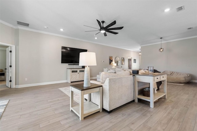 living room featuring ceiling fan, baseboards, visible vents, and light wood-style floors