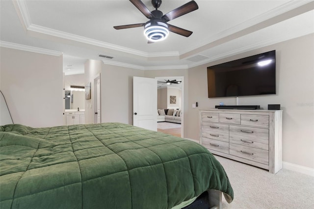 bedroom featuring visible vents, a tray ceiling, crown molding, and light colored carpet