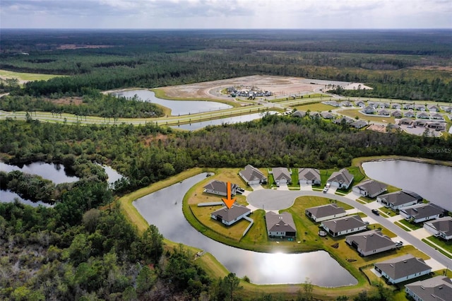 aerial view featuring a water view, a forest view, and a residential view