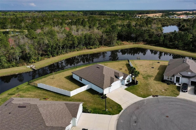 bird's eye view with a water view and a forest view