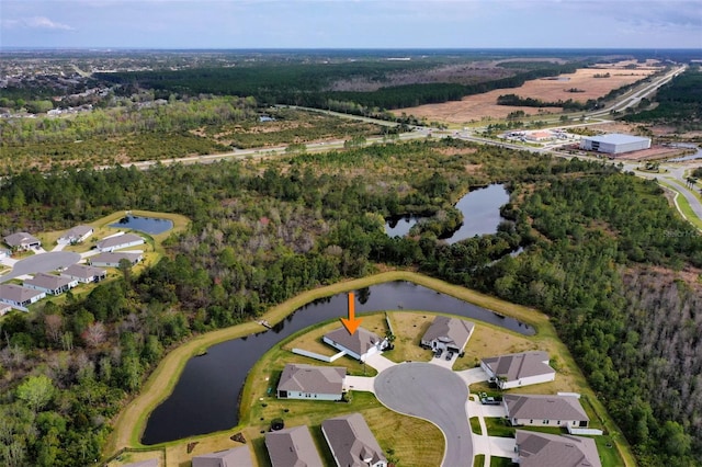 bird's eye view featuring a water view and a view of trees