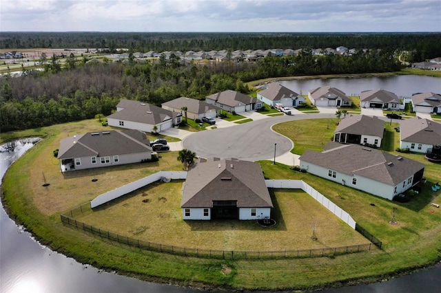 drone / aerial view featuring a water view and a residential view