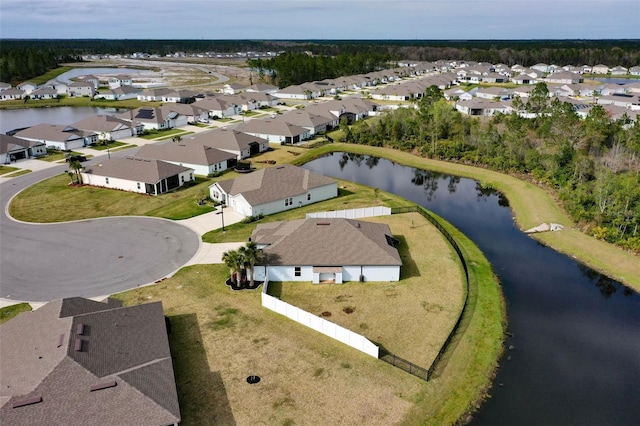 birds eye view of property featuring a residential view and a water view